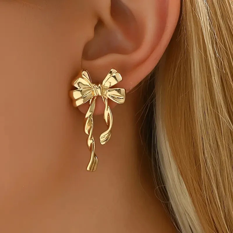 Elegant Golden Bow Dangle Earrings - Image 2